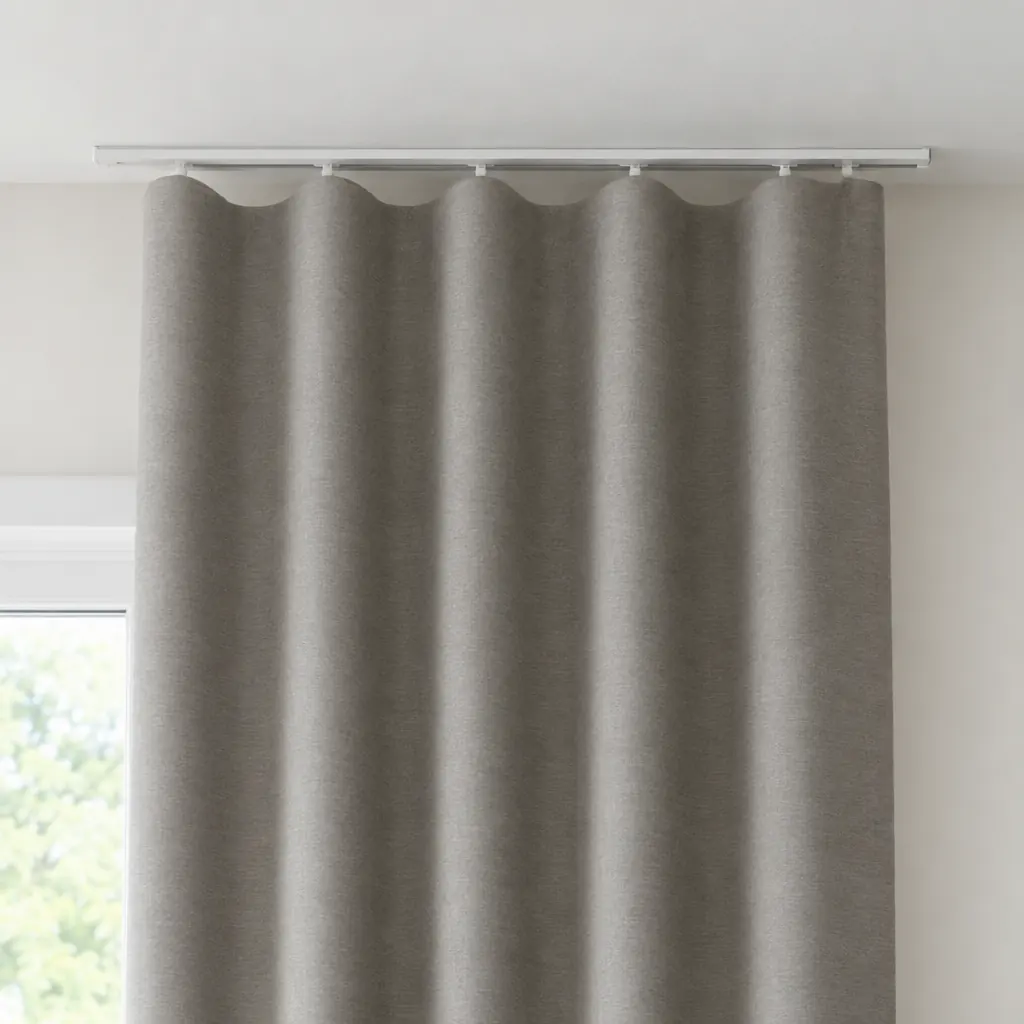 Warm grey wave heading curtains on a slim white ceiling track, forming even S-shaped waves
