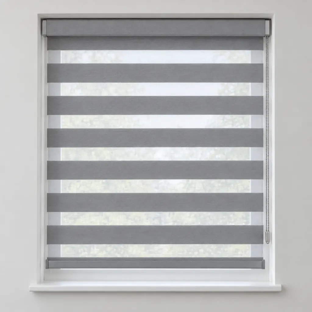 A grey day and night blind with alternating sheer and solid horizontal bands, fitted in a white recess with a chain on the right
