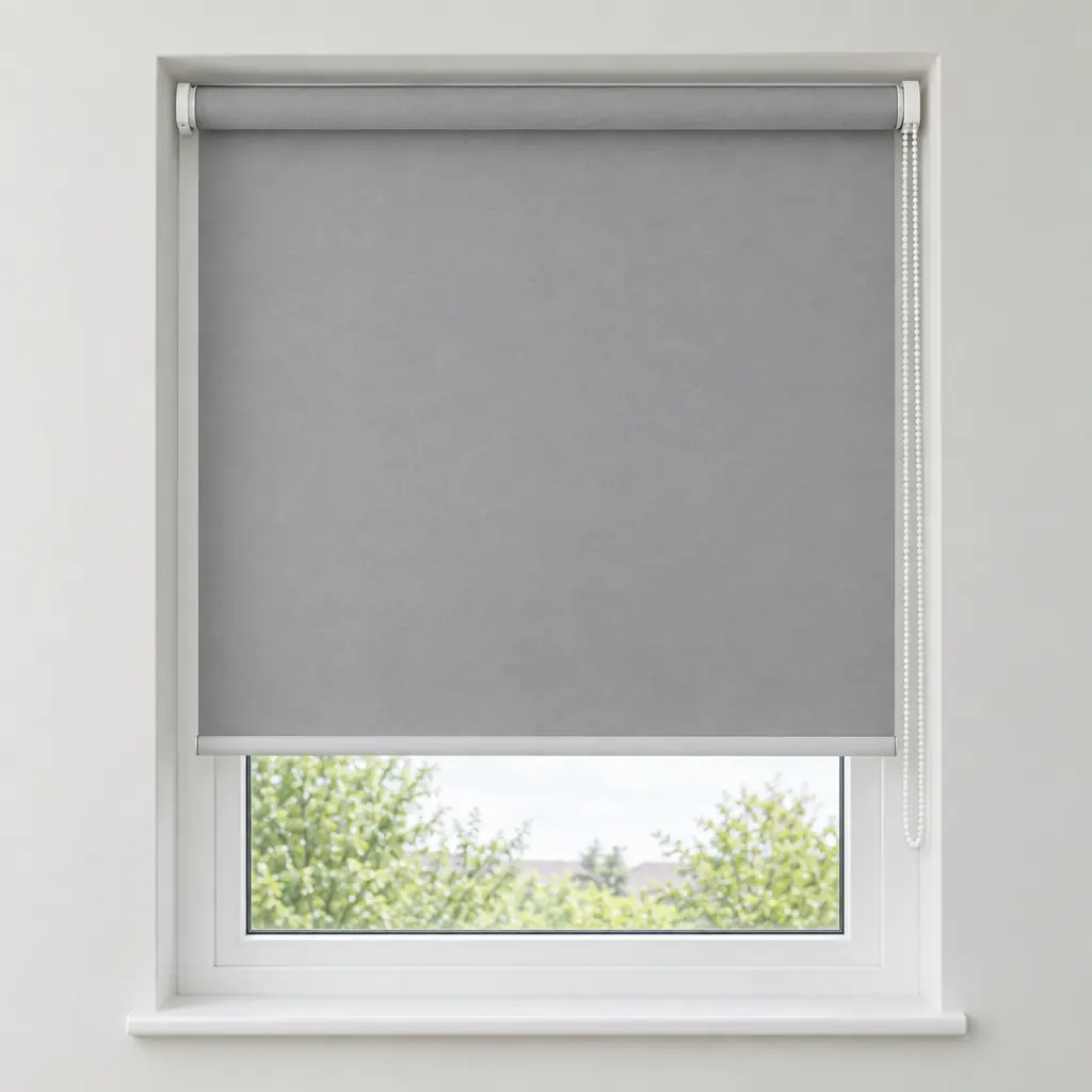 A light grey made-to-measure roller blind fitted inside a white window recess, two-thirds lowered, with a chain on the right